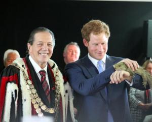 Prince Harry holds Henry the tuatara, from the Southland Museum and Art Gallery. Photo by Allison...
