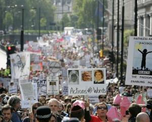 Protesters against Pope Benedict XVI's state visit to Britain march in central London. (AP Photo...