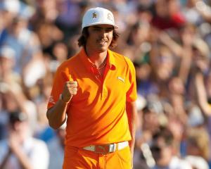 Rickie Fowler of the US pumps his fist after winning the Wells Fargo Championship in Charlotte,...