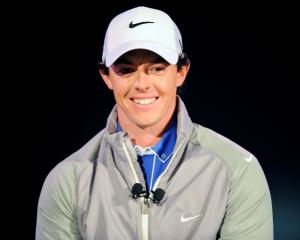 Rory McIlroy of Northern Ireland smiles during a presentation unveiling him as Nike's new...