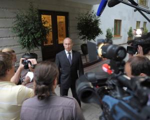 Russian President Vladimir Putin speaks to journalists at the Bocharov Ruchei state residence in...