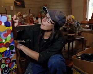 Seacliff artist Cathie McCarthy turns second-hand junk into art and fun kiwiana which she will...