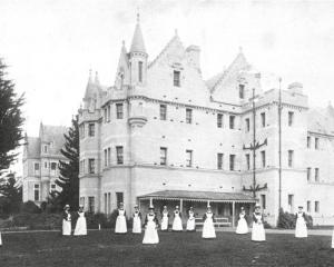 Seacliff Lunatic Asylum nursing staff pose on the lawn in front of the building, c 1890, in this...