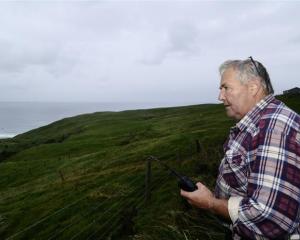 Senior Constable Lox Kellas, of Portobello, stays in radio contact with the Otago Regional Rescue...