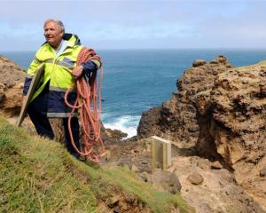 Senior Constable Lox Kellas, of Portobello, with part of the newly-installed life ring casing...