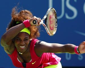 Serena Williams of the US hits a return to Ekaterina Makarova of Russia during their women's...
