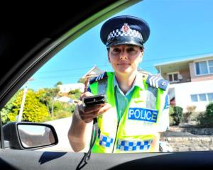 Sergeant Tania Baron, in charge of the Dunedin strategic traffic unit, breath-tests drivers at a...