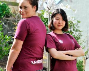 Sia Caldwell (left) and Sherry Sim model the 2013 ''Good One'' T-shirts they designed. Photo by...