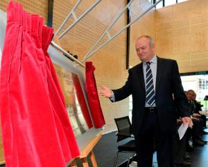 Sir Graham Henry unveils the foundation plaque;  the new $4 million centre.