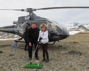 Sophie Newbold, of Gibbston, tees off on the Remarkables mountain range with Peugeot New Zealand...