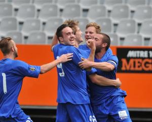 Southern United players celebrate after Andrew Ridden's goal. Photos by Gregor Richardson.
