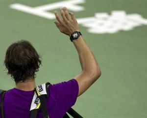 Spain's Rafael Nadal waves to spectators after losing his third-round match to Florian Mayer of...