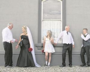 Stuart Ellwood and Angela Walton with their attendants at their Outram wedding in February.
...