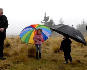 Tahu (left), Ripeka (4) and Timoti (2) Potiki and Edward Ellison at the Maori blessing of the...