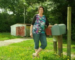 Teacher Sarah Roberts outside her family farm. Photo by Chris Morris.