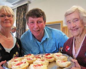 Tempting Myrtle Whittington with scones at the Anzac Day Diggers Breakfast in Wanaka yesterday...