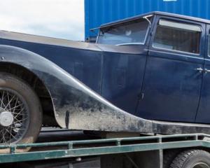 The 1922 Rolls-Royce Silver Ghost belonging to Michael Swann is trailered to a secure location...