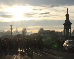 The crowd at the service at the Balclutha cenotaph were asked to think of the town 100 years ago...