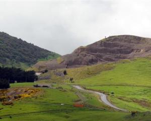 The Dunedin City Council says this groove (right) appeared in the ridgeline of Saddle Hill in...