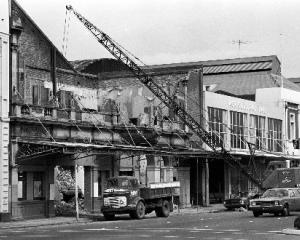 The last of the old facade being removed in 1975.
