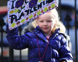 Third-generation playcentre child Laura Allison (5) shows her support for the early childhood...