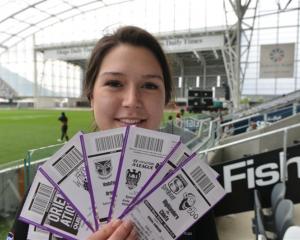 Ticketing assistant Whitney Kooman with tickets for events at Forsyth Barr Stadium. Photo by...
