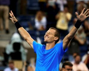 Tomas Berdych of the Czech Republic celebrates after defeating Roger Federer of Switzerland in...