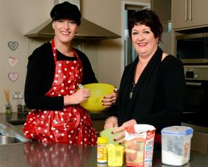 Trista Townsend and mother Elaine Schuck  prepare for next week's baking fundraiser. Photo by...