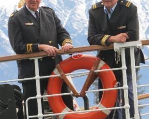 TSS Earnslaw skipper Laurie Stanton (left) and senior skipper Graham "Twinny" Moore-Carter stand...