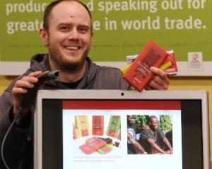 University of Otago postgraduate applied science researcher Jason Taylor shows the Trade Aid...