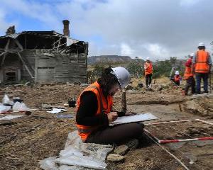 University of Otago student Megan Hickey maps the site of the Robinson farmstead complex at...