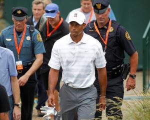 US golfer Tiger Woods walks to the 18th green during a practice round for the 2013 US Open at the...