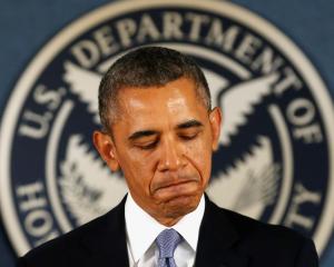 US President Barack Obama speaks about the government shutdown during a visit to the Federal...