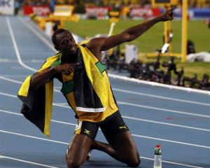 Usain Bolt of Jamaica celebrates winning the men's 200 metres final. REUTERS/Michael Dalder