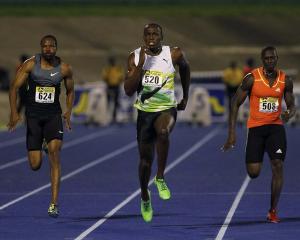 Usain Bolt of Jamaica sprints to win the men's 100 metres event at the Jamaica International...