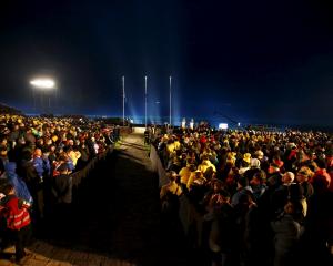 Visitors from Australia and New Zealand attend a dawn ceremony marking the 100th anniversary of...