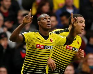 Watford's Odion Ighalo celebrates scoring his side's third goal against Liverpool. Photo Reuters