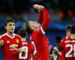 Wayne Rooney celebrates after scoring his first goal. Photo Reuters