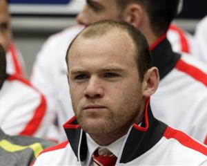 Wayne Rooney waits for the start of the FA Cup semifinal between Manchester United and Manchester...