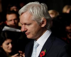 WikiLeaks founder Julian Assange leaves the High Court in central London after the court ruled he...