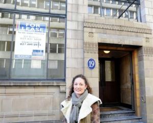 Woods Adams building owner Michelle Kennard, in front of the Bond St building she has restored...