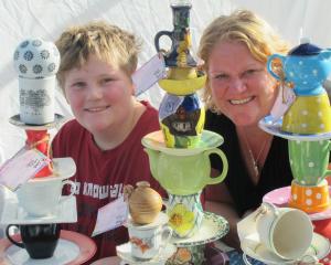Debbie Beatson, of Wingatui, and her son Daniel (10) display their colourful garden totems at the...