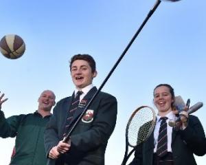 Head of sport Jeremy Scott and year 13 pupils Jesse Irvine (left) and Jess Chisholm (both 17)...