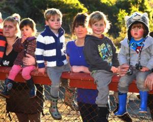 Children and parents from the former Kidsown Early Learning Centre (from left) Harper Wilson (4),...