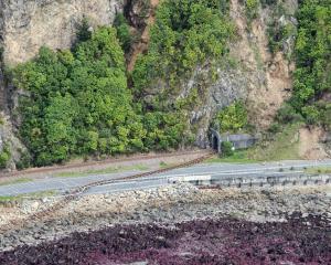 Damaged railway track across State Highway 1. Photo: Reuters