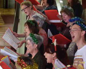 Pictured yesterday singing at the library are (clockwise, from top left) Beth Goulstone, Andrea...
