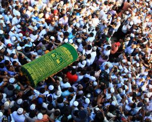 Supporters carry the coffin of Ko Ni, a prominent member of Myanmar's Muslim minority and legal...