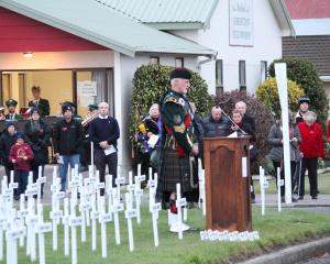 Alex McLaughlin addresses the crowd at the Balclutha Anzac Dawn Service. PHOTO: SAMUEL WHITE 