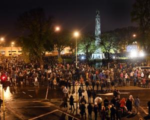 Thousands marked Anzac Day commemorations at Queens Gardens in the shadow of the Dunedin Cenotaph. Photo: Stephen Jaquiery.