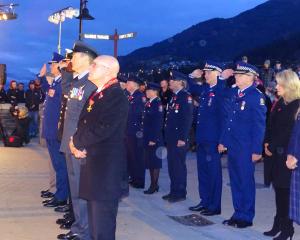 Queenstown Mayor Jim Boult (front left) and New Zealand Police Commissioner Mike Bush (left) were among the dignitaries at the Queenstown dawn service by Queenstown's Memorial Gates on the waterfront. PHOTO: GUY WILLIAMS